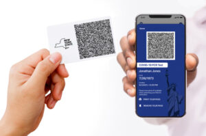 Image of card with QR code and smartphone with QR code.